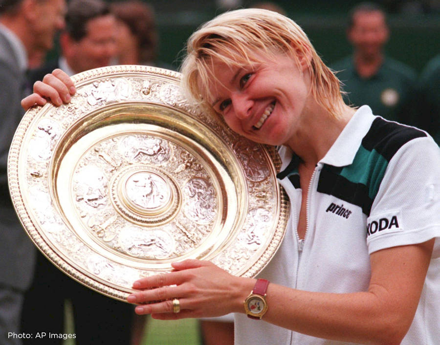 Jana Novotna Resting On Wimbledon Trophy Wallpaper