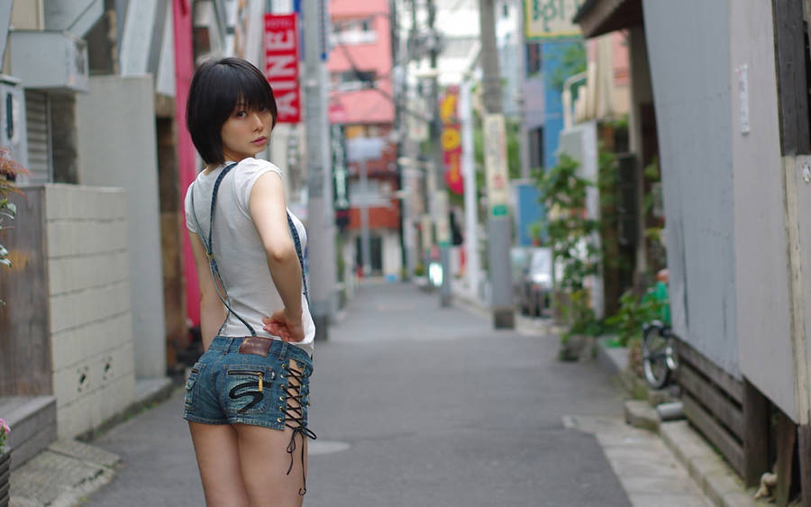 Japanese Girl On City Street Wallpaper