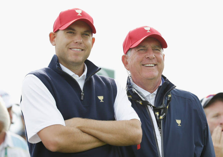 Jay Haas And Son Watching Golf Match Wallpaper