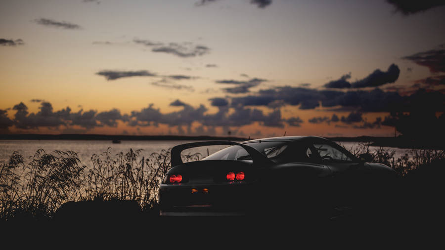 Jdm Car Near Sea After Sunset Wallpaper