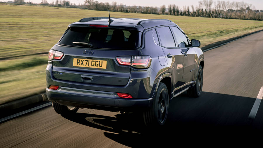 Jeep Compass On Road With Grass Wallpaper