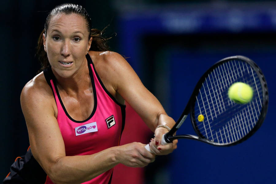 Jelena Jankovic Performing A Double-handed Stroke In A Tennis Match Wallpaper