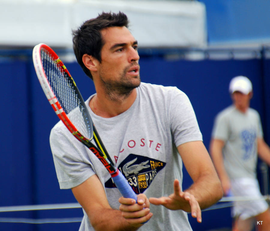 Jeremy Chardy In Action With Tennis Racket Wallpaper