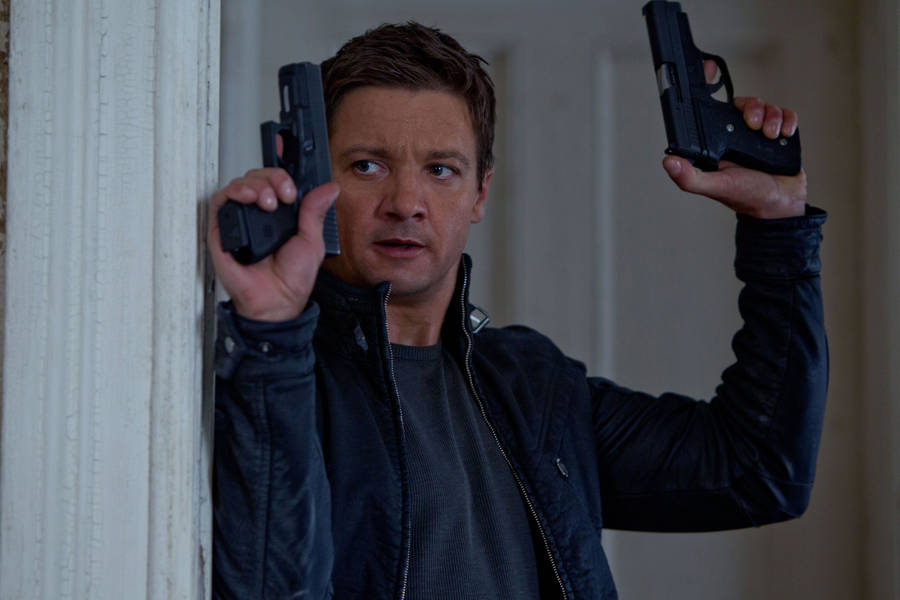 Jeremy Renner's Dual Pistol Wallpaper