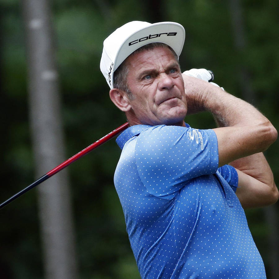 Jesper Parnevik Cobra Cap And Shirt Wallpaper