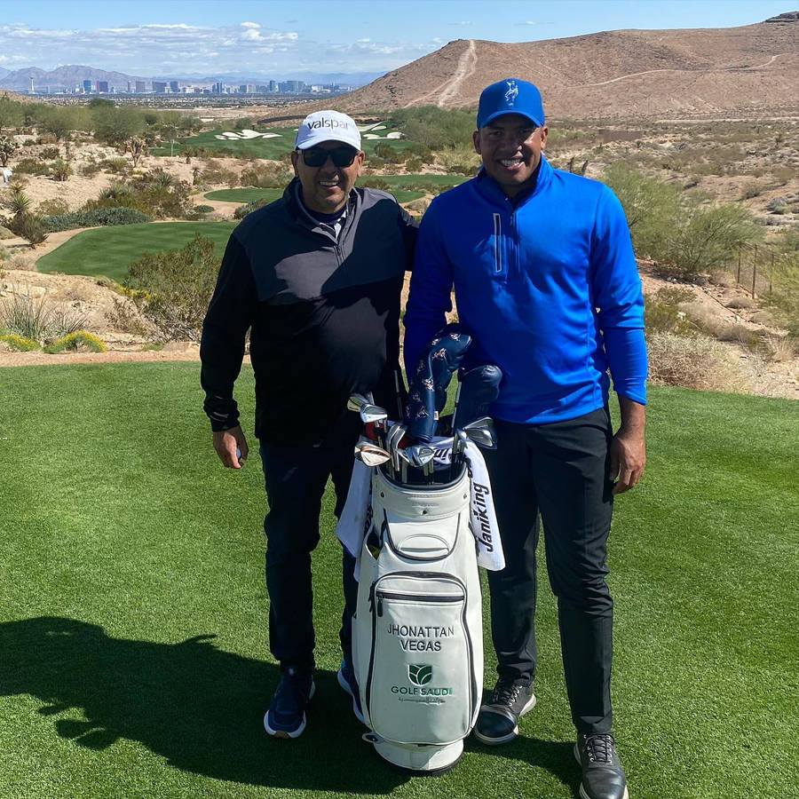 Jhonattan Vegas Posing With A Fan Wallpaper