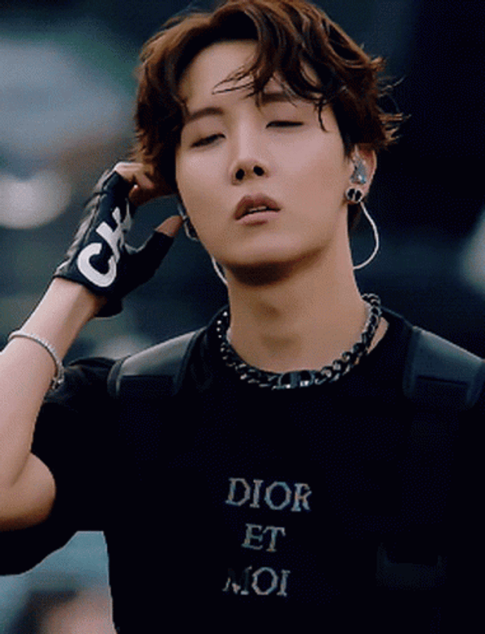 Jhope - The Charismatic Dancer Of Bts In An Energetic Performance Wallpaper