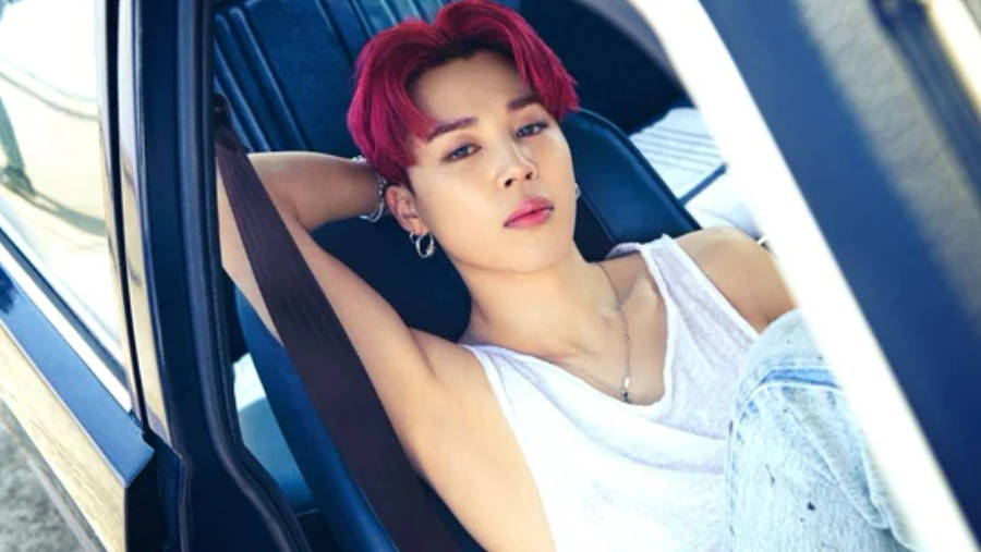 Jimin Of Bts Posing In A Car Wallpaper