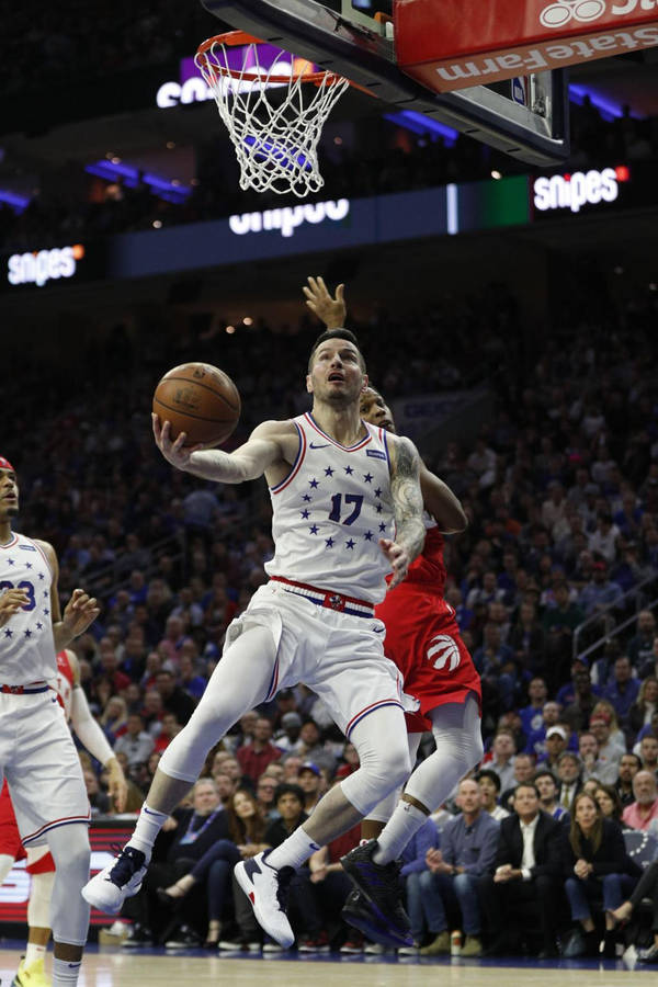 Jj Redick Jumping With A Ball Wallpaper