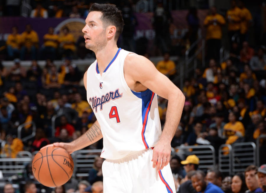 Jj Redick While Dribbling The Ball Wallpaper