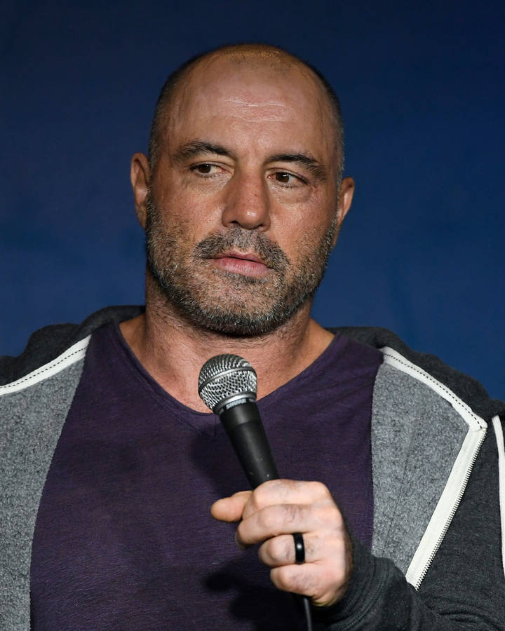 Joe Rogan Live Performance At A Comedy Show Wallpaper