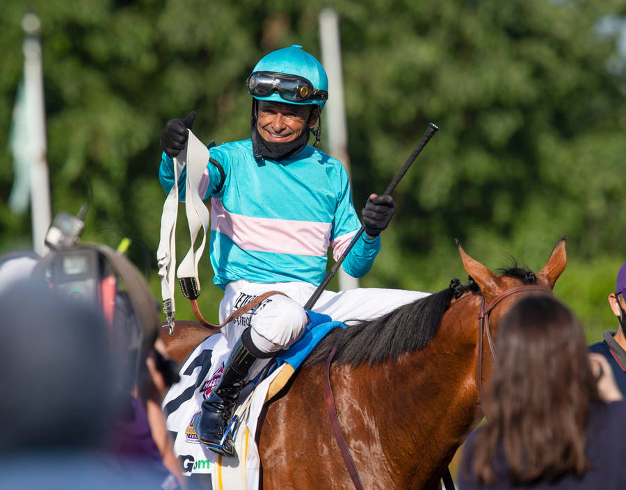 Joel Rosario Riding The Acclaimed Uni To A Victorious Finish At The Kentucky Derby Wallpaper