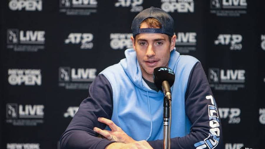 John Isner During A Press Conference Wallpaper