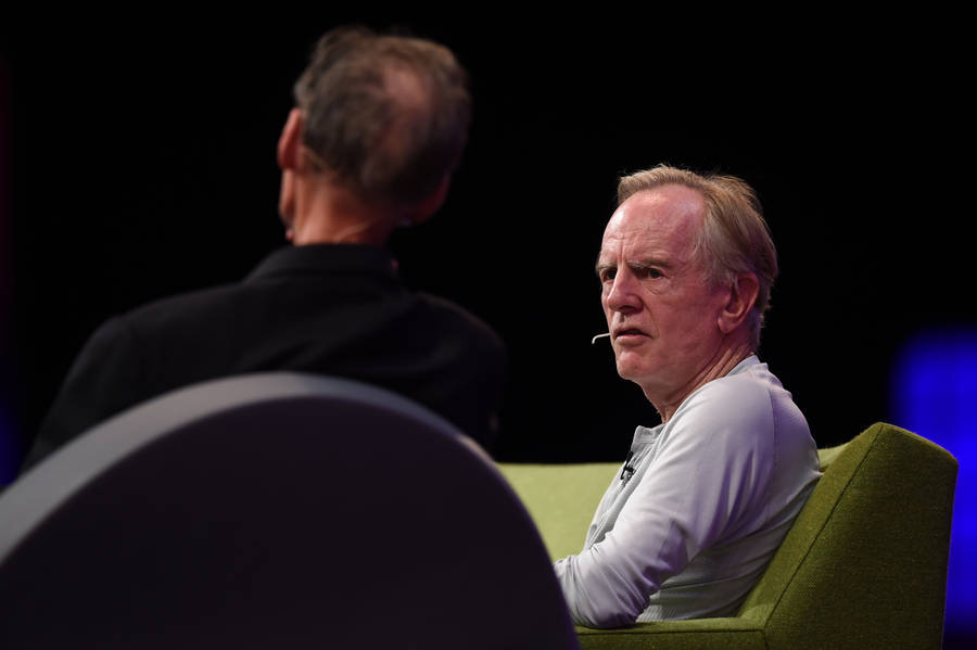 John Sculley Engaged In A Panel Discussion Wallpaper