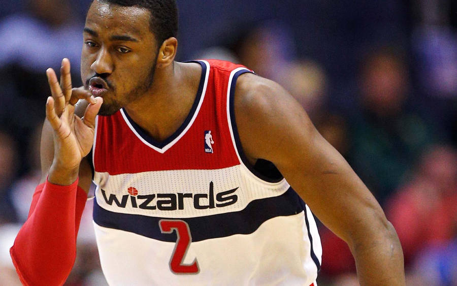 John Wall Making A Three-point Sign Wallpaper