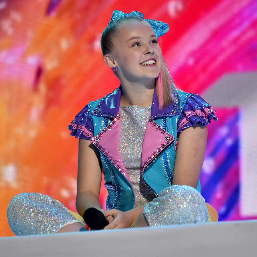 Jojo Siwa Sitting Down Wallpaper