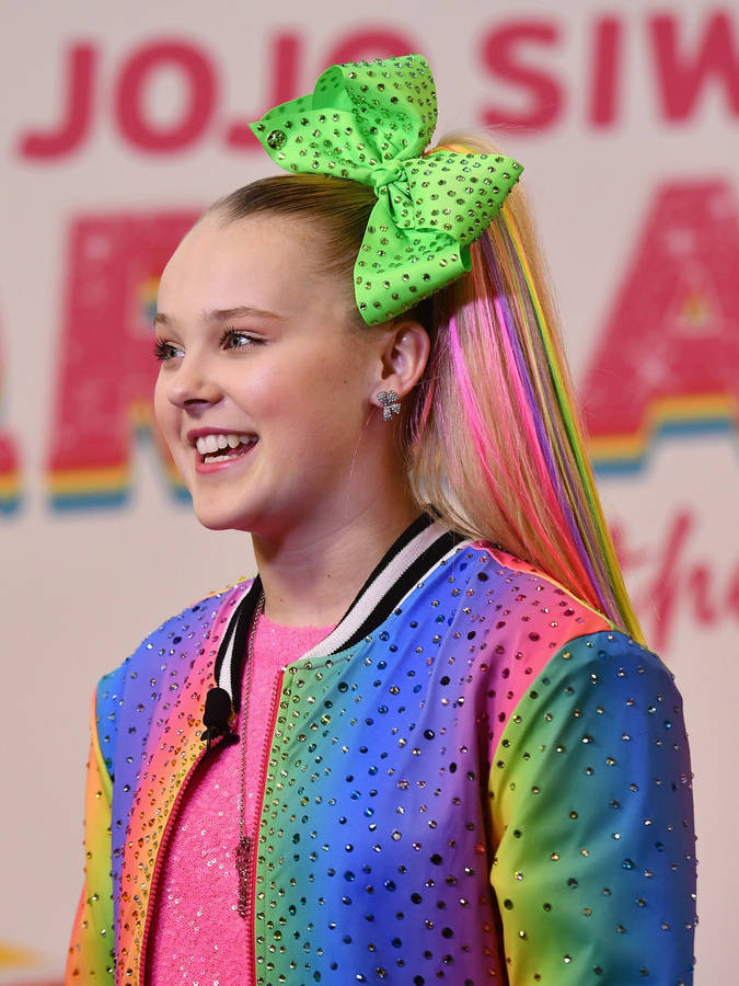 Jojo Siwa Wearing Rainbow Jacket Wallpaper