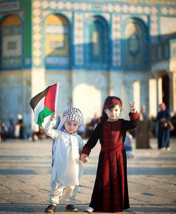 Joyful Palestinian Kids Celebrating Eid Al-fitr Wallpaper