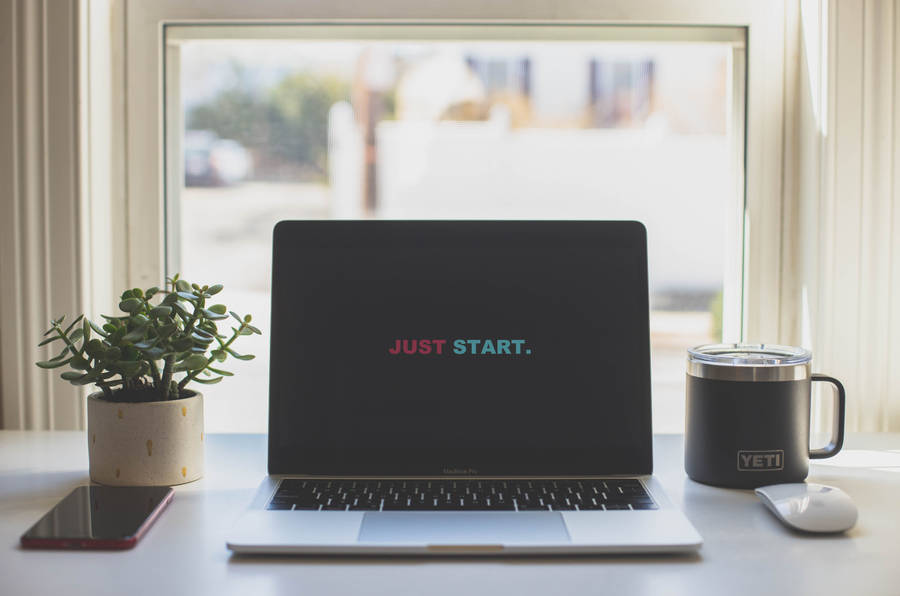 Just Start Motivational Phrase On Laptop Wallpaper