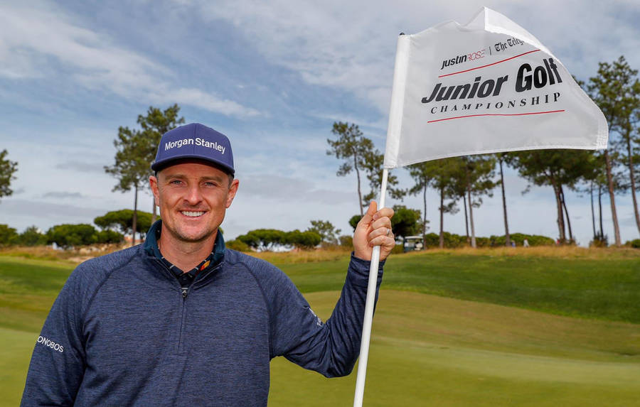 Justin Rose Holding A White Flag Wallpaper