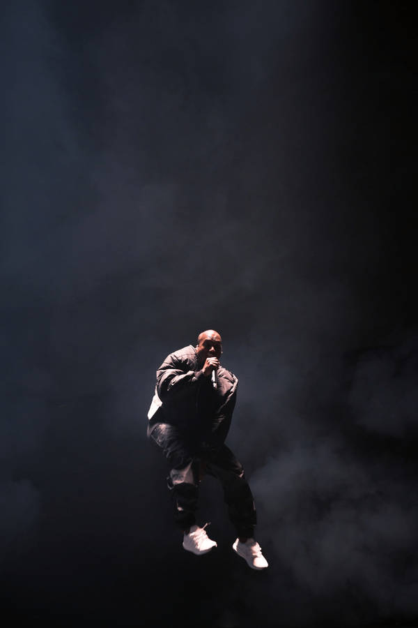 Kanye West Jumping On Stage Wallpaper