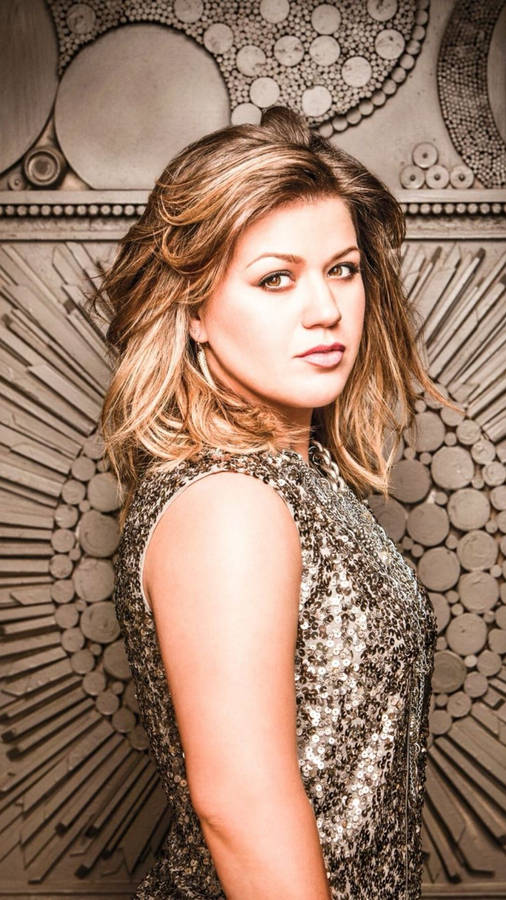 Kelly Clarkson In Silver Dress Wallpaper