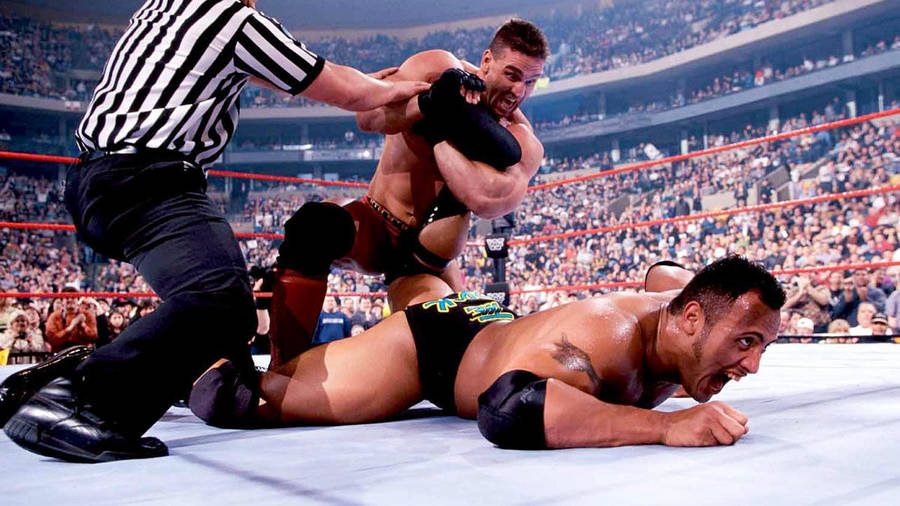 Ken Shamrock Winning Against The Rock Wallpaper