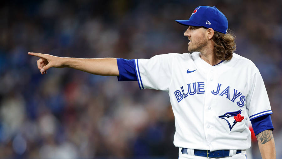 Kevin Gausman Wearing A White And Blue Jersey Wallpaper