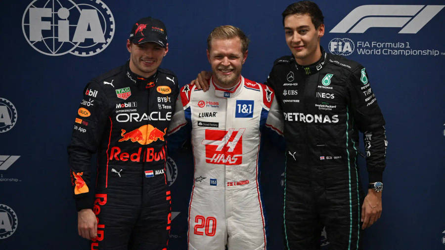 Kevin Magnussen Alongside Verstappen And Russel In A Thrilling F1 Race Wallpaper