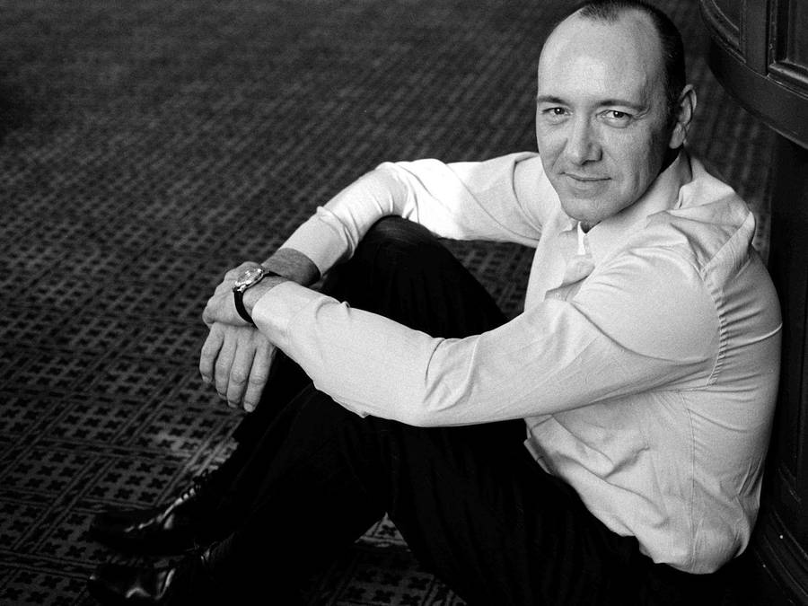 Kevin Spacey Contemplative On The Floor Wallpaper