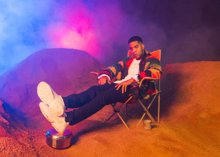 Kid Cudi Relaxedin Colorful Setting Wallpaper