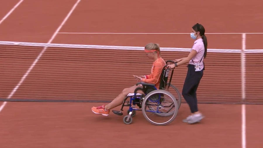 Kiki Bertens In A Wheelchair At A Tennis Tournament Wallpaper