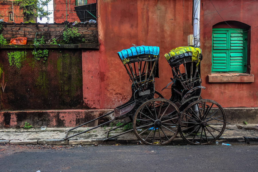 Kolkata Street Scene With Traditional Rickshaw Wallpaper