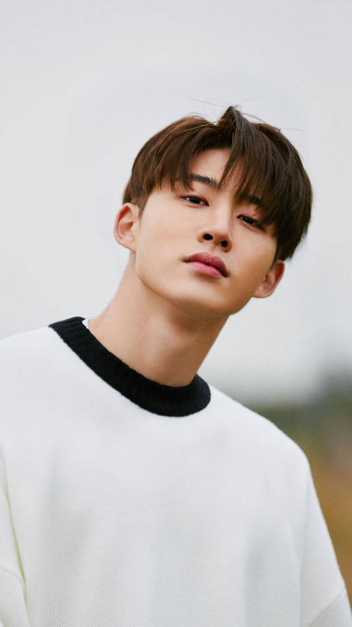 Korean Rapper, Kim Hanbin, Captivating In A Candid Shot Wallpaper