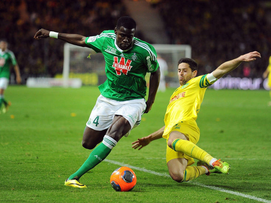 Kurt Zouma Kicking Orange Ball Wallpaper