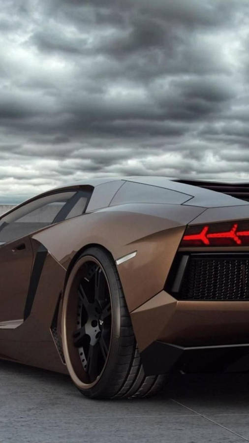 Lamborghini Iphone Brown Under Dark Clouds Wallpaper