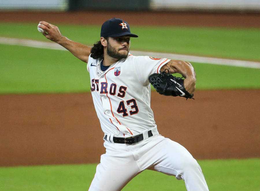 Lance Mccullers Poised In Action On Lush Green Mlb Field Wallpaper