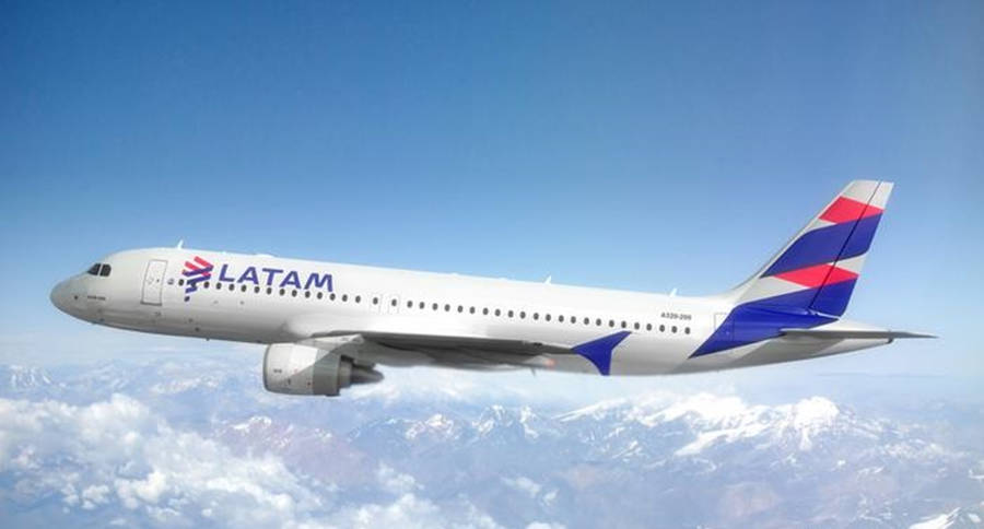 Latam Plane Flying On Top Of Cloudy Sky Wallpaper