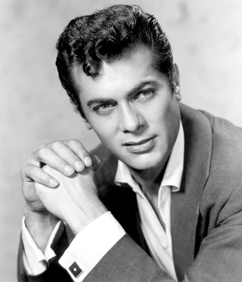 Legendary Actor Tony Curtis With Hands Together Wallpaper