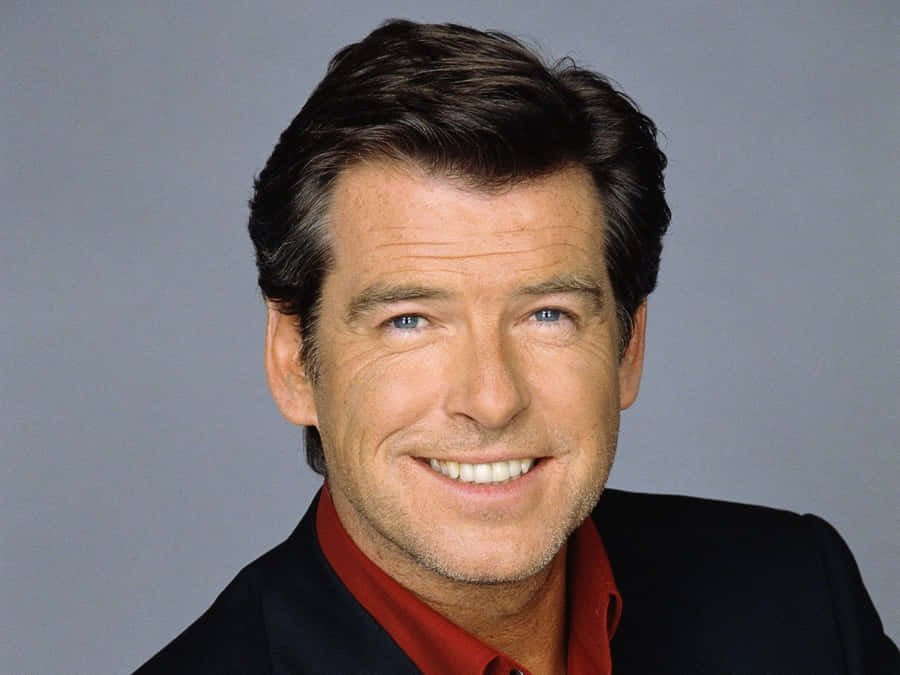 Legendary Hollywood Star Pierce Brosnan In A Candid Portrait Shot Wallpaper