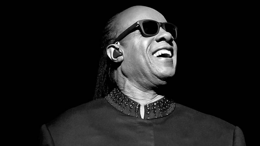 Legendary Music Icon, Stevie Wonder, In A Classic Black & White Portrait Wallpaper