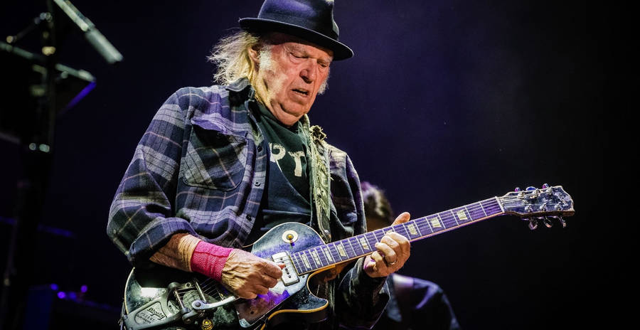 Legendary Musician Neil Young Performing At Festival D'ete De Quebec Wallpaper