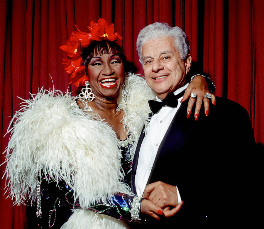 Legendary Musicians Tito Puente And Celia Cruz In Concert Wallpaper