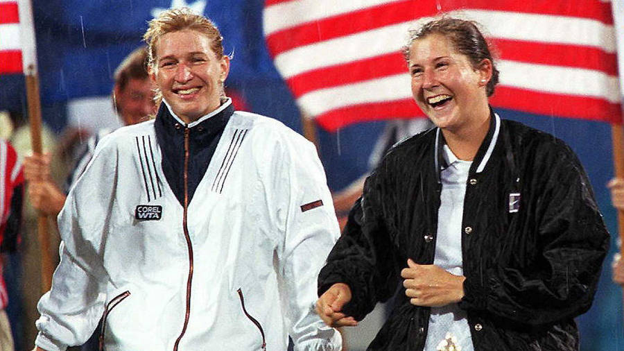 Legendary Tennis Icons Monica Seles And Steffi Graf Sharing A Laugh Wallpaper