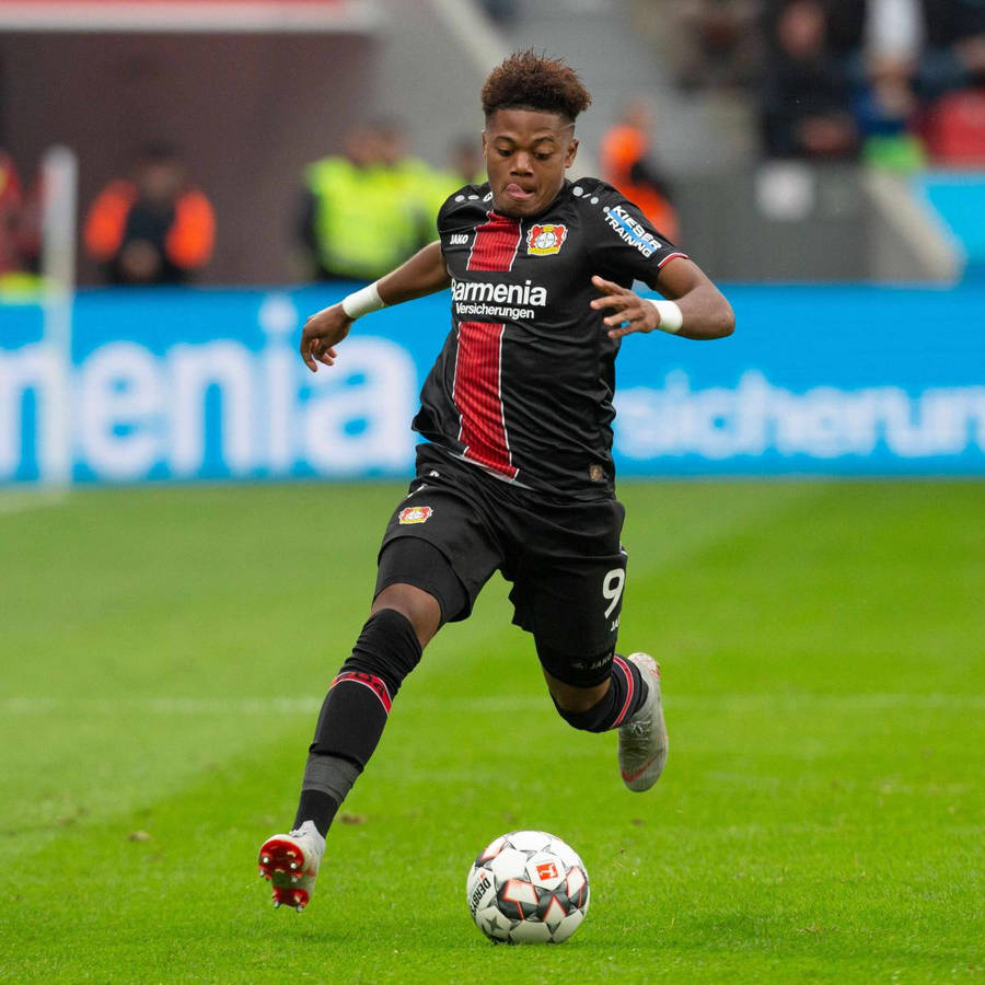 Leon Bailey Leverkusen Running Ball Wallpaper