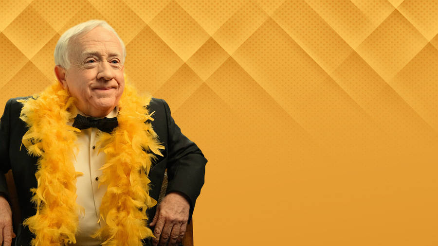 Leslie Jordan Feathery Orange Background Wallpaper