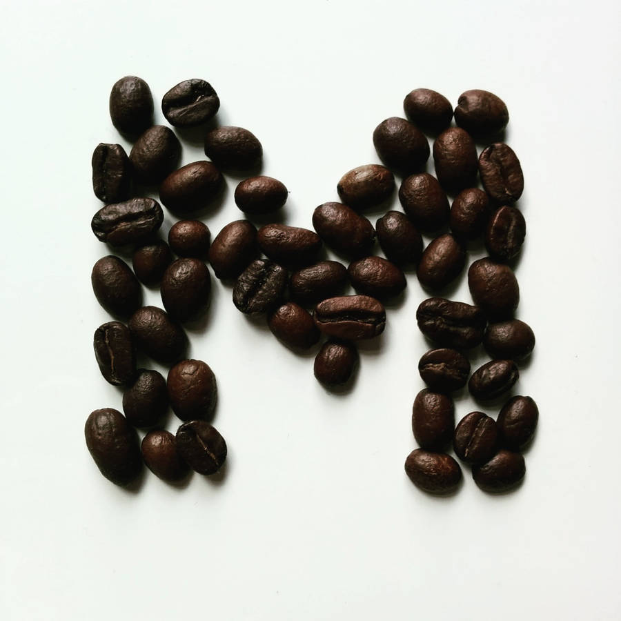 Letter M Formed With Coffee Beans Wallpaper