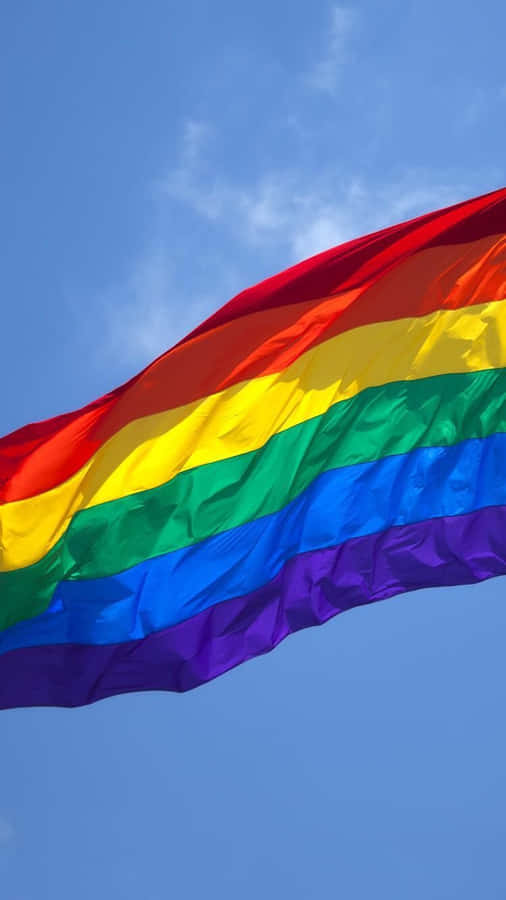 Lgbt Flag Over The Blue Sky Iphone Wallpaper