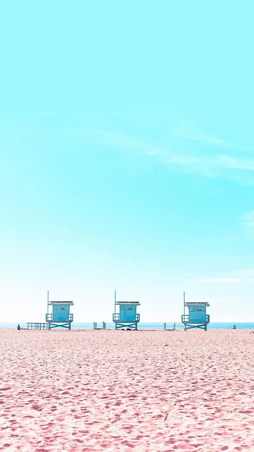 Lifeguard Huts On The Beach Wallpaper