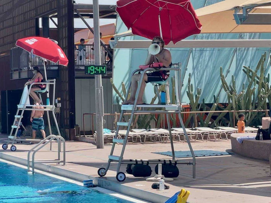 Lifeguard On Guard At Poolside Wallpaper